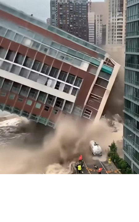 Flooding causes complete collapse of riverside buildings!